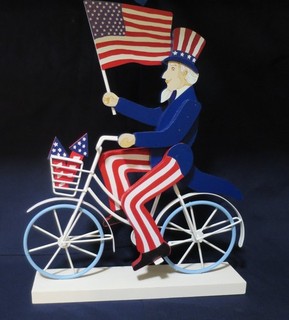 Patriotic Uncle Sam on Bicycle Shelf Decor