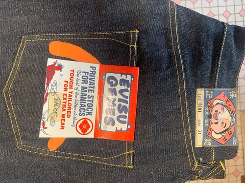 Evisu genes jeans W32/L48 hand painted orange logo