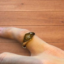 Lovely vintage style signet ring with diamond star detail in gold.