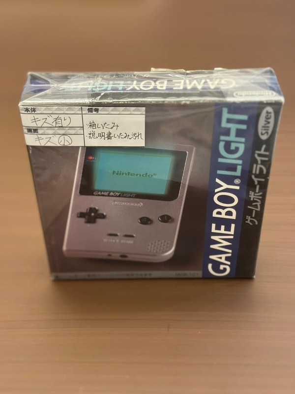 Nintendo Game Boy Light Launch Edition Silver  , Sealed . with old  invoice