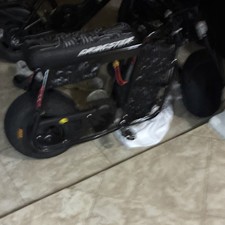 Electric Black Motor Scooter with Patterned Seat
