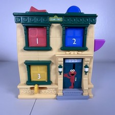Playskool Sesame Street Hide N Seek Pals Elmo 2010 con sonidos Pop Out Doors juguete