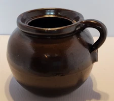 brown crock stoneware Jug Pot 6 tall 7 wide. appears old. but no chips or cracks