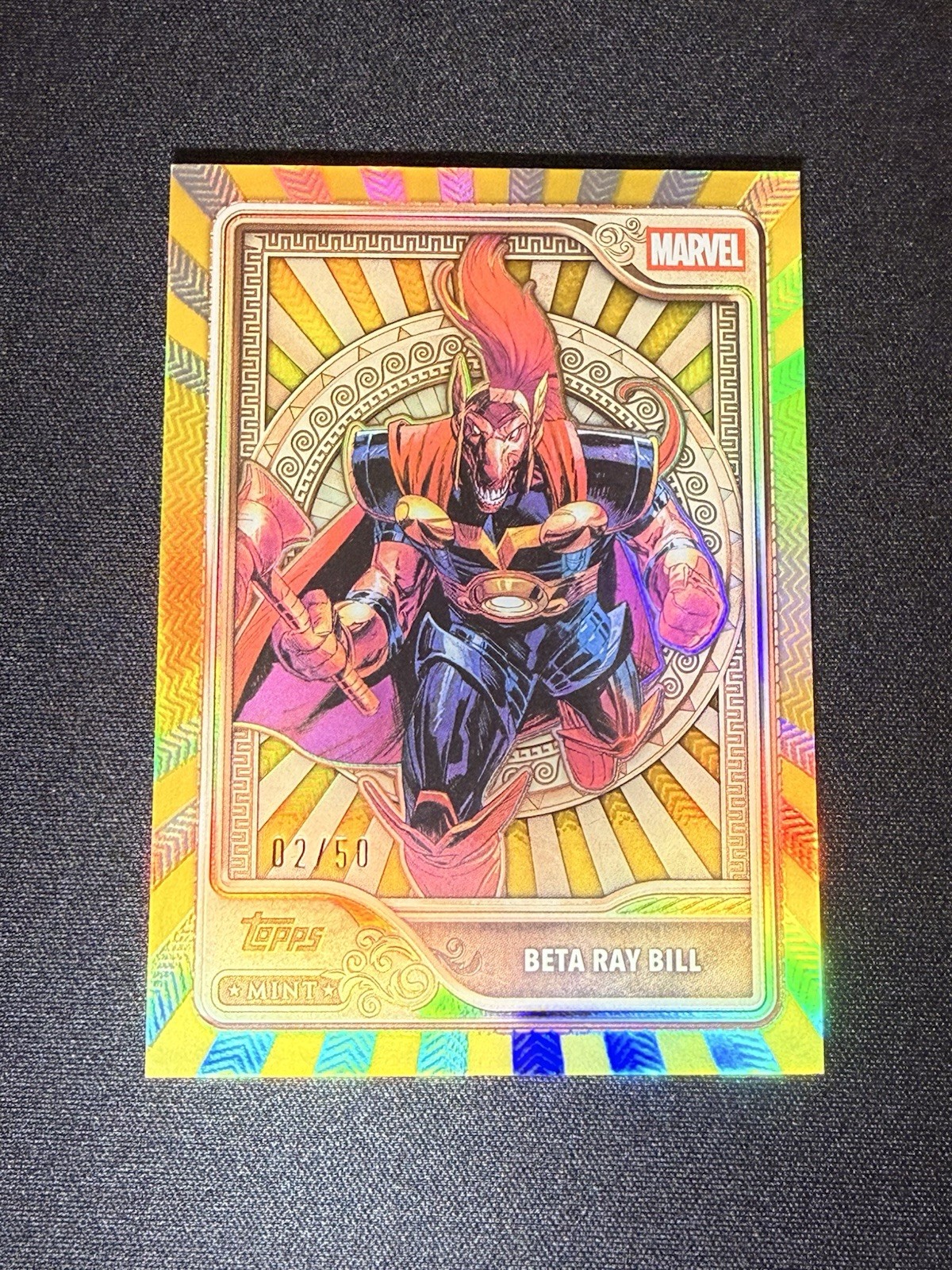 2026 Topps Marvel Mint Beta Ray Bill Gold /50 #34