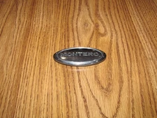 MITSUBISHI MONTERO FENDER  BADGE EMBLEM LH 2003-2006 OEM