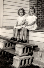1930's Girls in Dresses sitting on porch w/ cinder block steps - OOAK photo