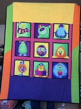 Handmade and Machine Sewn Quilted Baby Crib Quilt With Cute Monsters On It 44X54