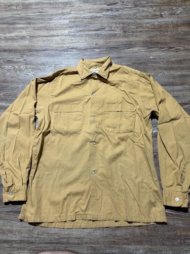 Light brown vintage Fruit Of The Loom men’s button up shirt size small with two chest pockets and button-down collar.