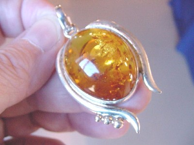 (p60-29) 12 grams  AMBER Poland .925 Sterling SILVER abstract WOMAN GIRL PENDANT