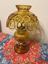 LE Smith electric lamp amber/yellow in color