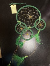 Green Dream Catcher With Green And Gold Beads And Green Feathers.