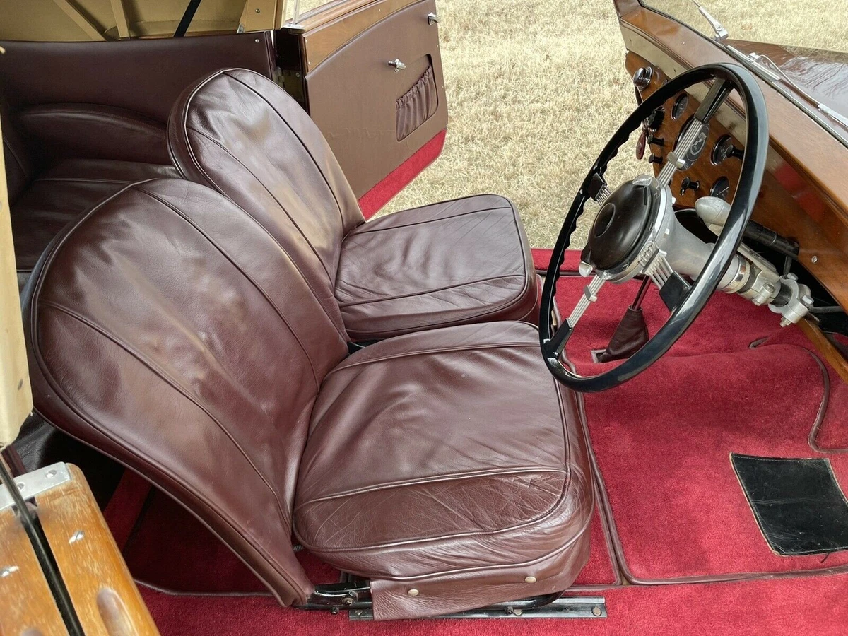 The interior is traditional British, leather and wood.