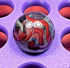 DAS/CHAMPION/WV/JABO BANGER CLEAR RIBBONED OXBLOOD SWIRL SHOOTER .70" BOX01/260