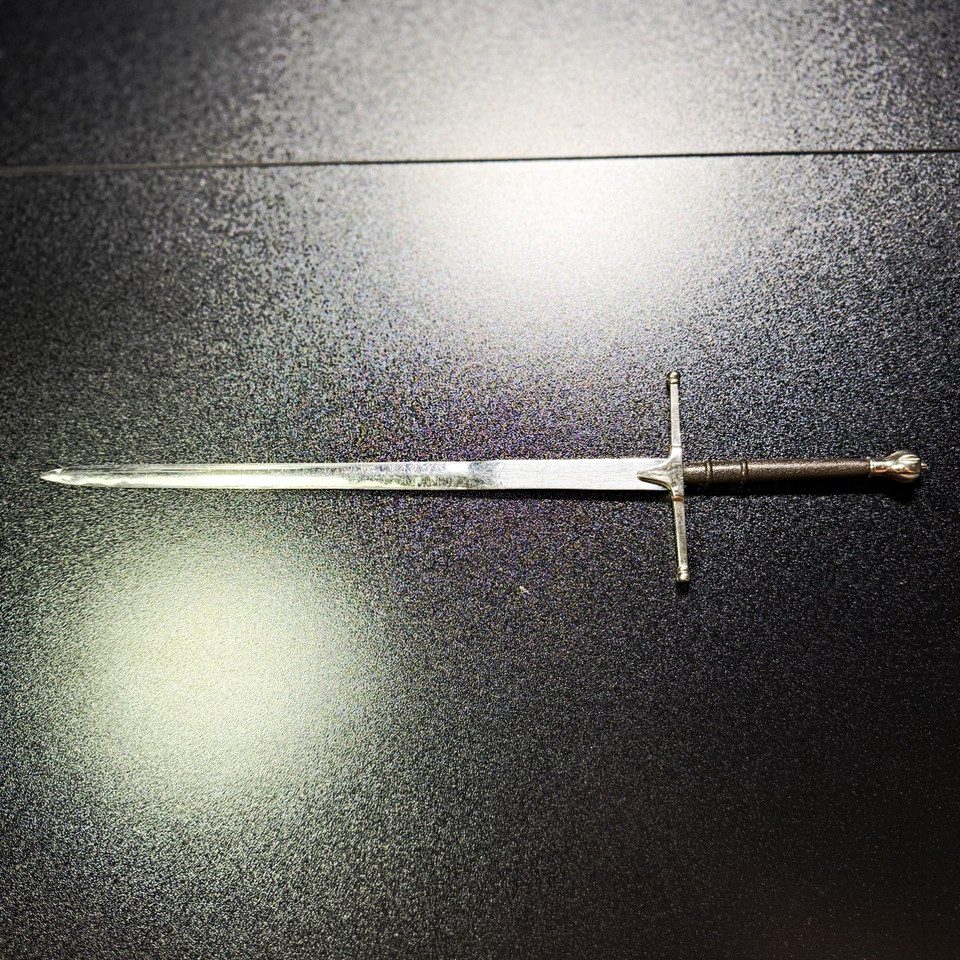 An 11" miniature medieval sword that doubles as a letter opener — because slaying your inbox deserves the right weapon.