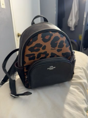 cheetah coach backpack Mini Court In Signature Canvas With Leopard Print Signature coated canvas printed coated canvas and refined pebble leather Inside zip and multifunction pockets Double zip closure fabric lining Handle with 1 1/2 drop Outside zip and open pockets Adjustable shoulder straps 7 3/4 (L) x 8 3/4 (H) x 3 1/2 (W) Style No. Coach Black/Brown Leopard Print Coated