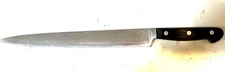 R.H.  Forschner carving knife approximately  10” blade 15” Total Length