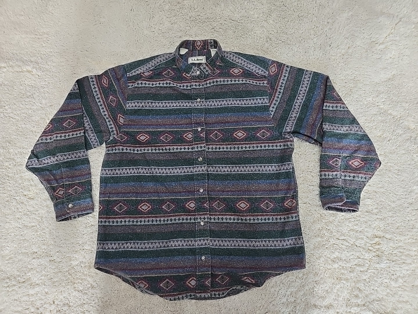 Vintage LL Bean men’s L shirt with gray, green, and red Aztec flannels, button down, and two chest pockets.