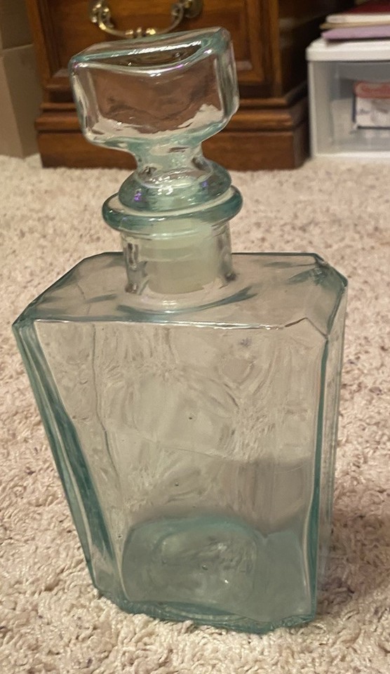 A rare Venetian green art glass liquor decanter that's more sculpture than barware — the kind of piece that stops guests mid-sentence.