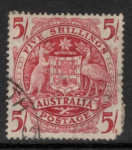 AUSTRALIA 1949  5/- CLARET COMMONWEALTH COAT OF ARMS  STAMP VFU.