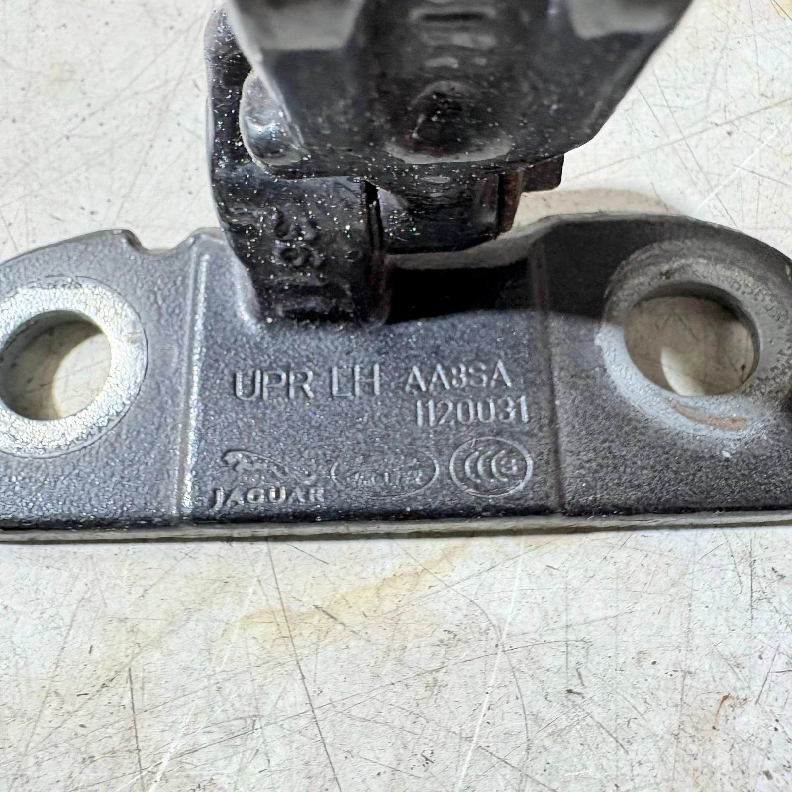 AA8SA1120031 UPR LH Jaguar door hinge engineering marking