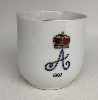 Porcelain cup with a molded Queen Alexandra portrait lithophane in the bottom