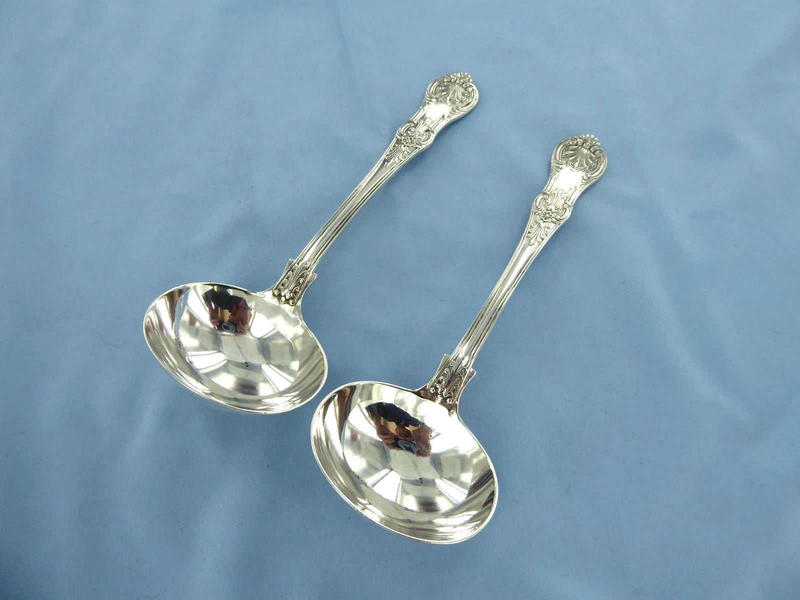 AN ANTIQUE PAIR OFSTERLING SILVER QUEENS PATTERN SAUCE LADLES, LONDON 1869.
Opens in a new window or