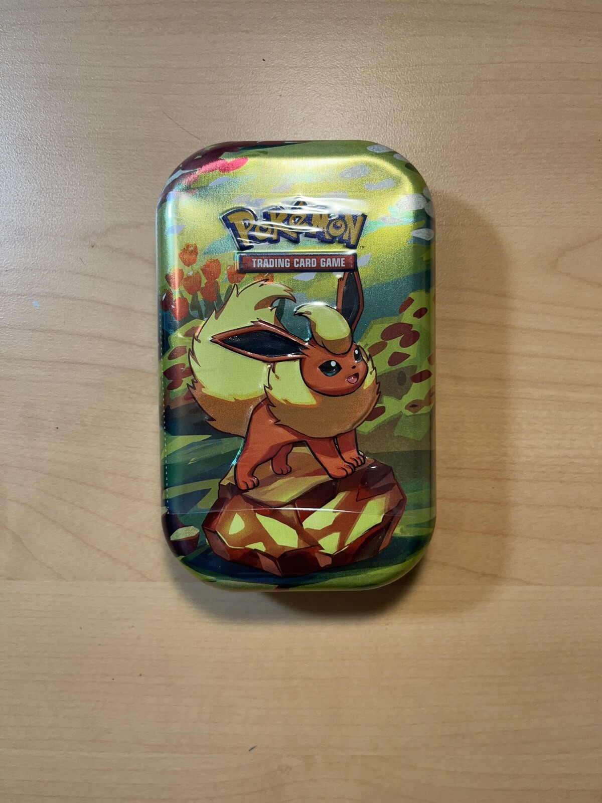 Pokémon Scarlet & Violet Prismatic Evolutions Mini Tin Flareon- In Hand