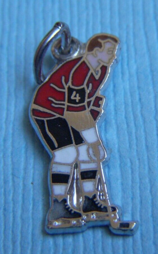 Vintage enamel hockey player sterling charm