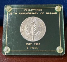 1942 - 1967 One Peso Philippines 25th Anniversary of Bataan Green Capital Holder