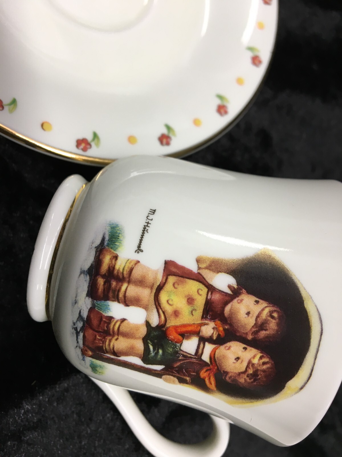 M.J. Hummel Tea Cup & Saucer STORMY WEATHER