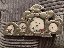Whimsical pewter dog-themed picture frame.