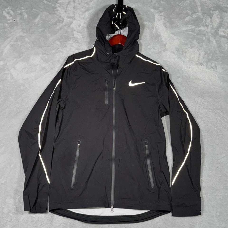 Chaqueta Nike Storm Para Hombre Pequeña Negra Escudo Con Capucha Correr Cortavientos Reflectante Foto 2 de 4
