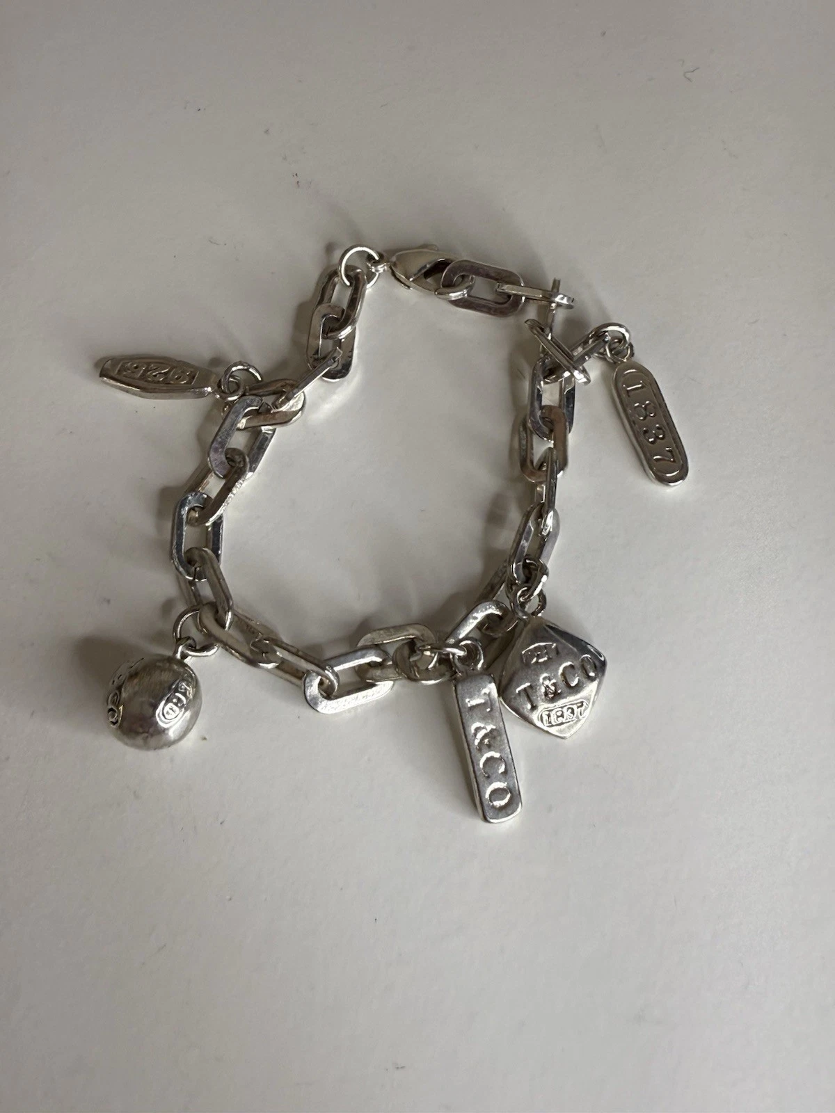 Tiffany & Co. Sterling Silver 5 Charm Rectangle Link 7.5”Bracelet