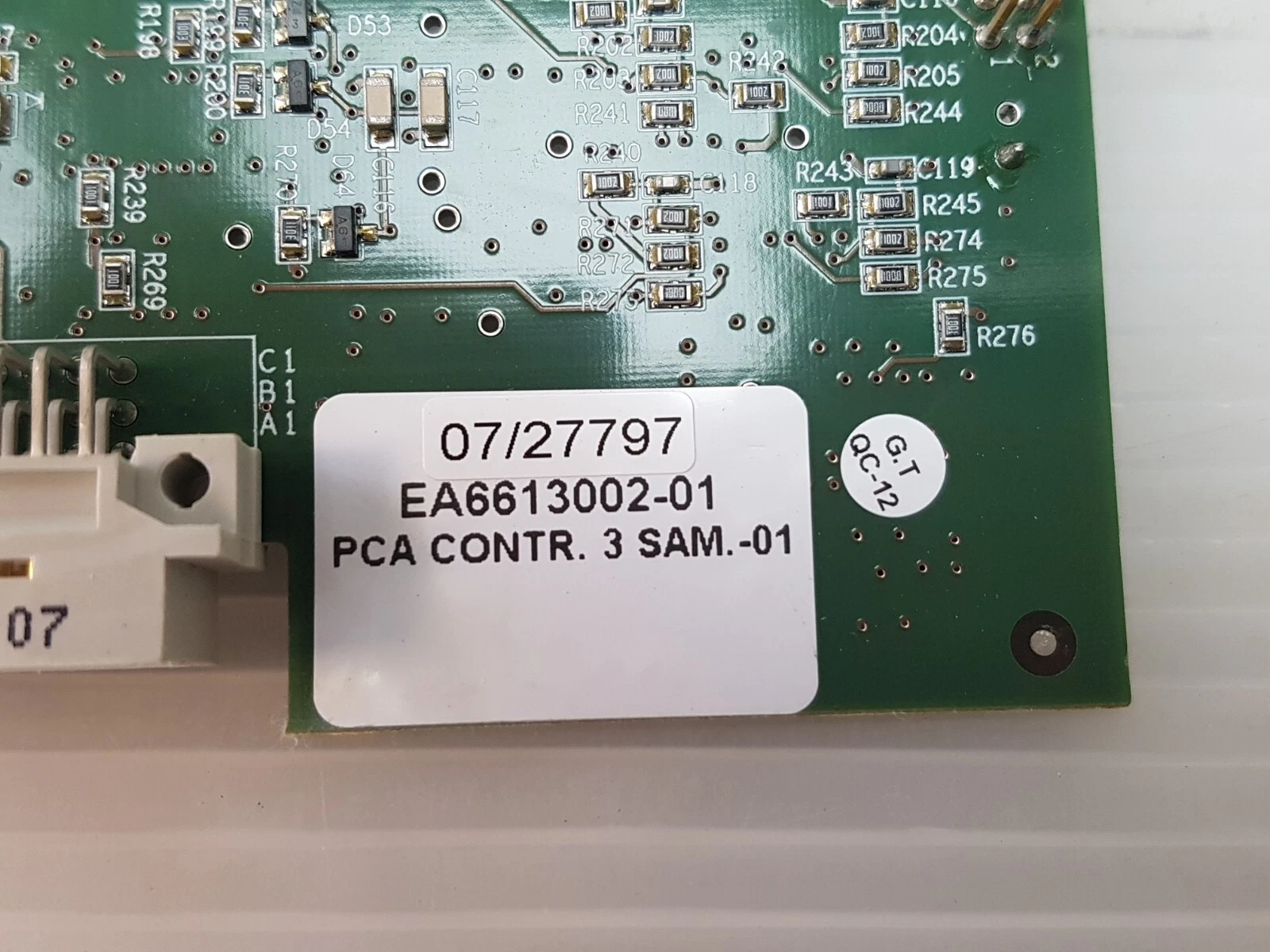 Close-up of the label reading EA6613002-01 PCA CONTR. 3 SAM.-01