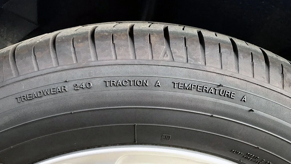 Tire markings for treadwear, traction, and temperature standards
