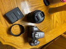 Canon EOS Rebel T6 With a 18-200mm Tamron Lens with a tulip hood lens