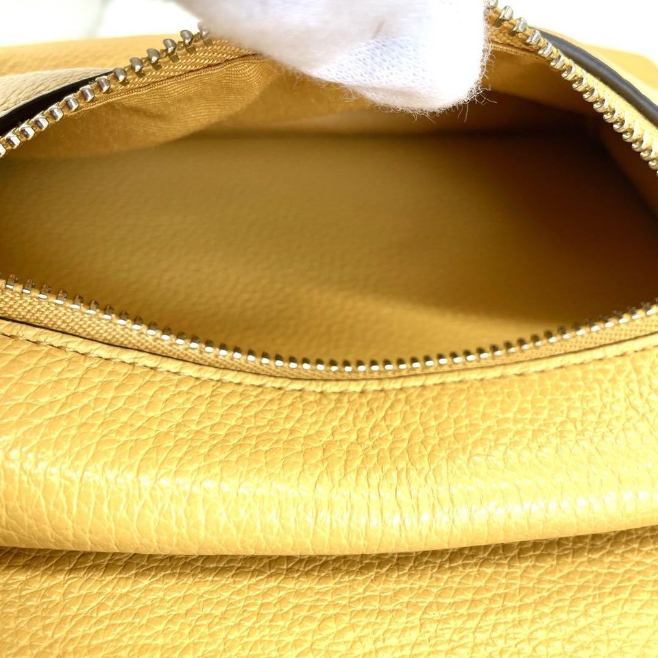 COACH All Leather Mini Backpack Yellow Mustard color that is easy to