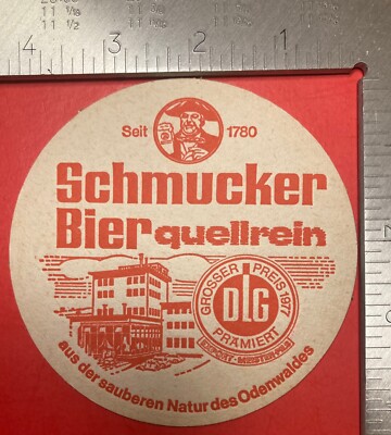 SCHULTHEISS. WAS TRINKEN WIR? SCHMUCKER BIER 4.2 INCH ROUND BEER COASTER