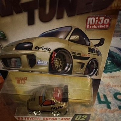 MGA Entertainment CarTUNED Series MJI MiJo Diecast Toyota Supra A90 1993 Gold
