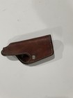 Brown leather Bauer Bros WA250 gun holster with molded pistol shape, double stitching, and metal screw hole.