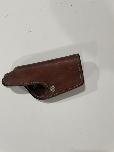 Brown leather Bauer Bros WA250 gun holster with molded pistol shape, double stitching, and metal screw hole.