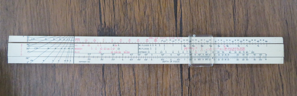 A 1946 slide rule built *specifically* for photographers to calculate film exposure — a wildly niche analog tool almost no one knows existed.