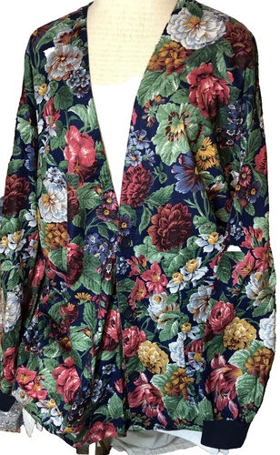 SCRUBS long sleeved multi color floral top with two front pockets. Size 4XL.