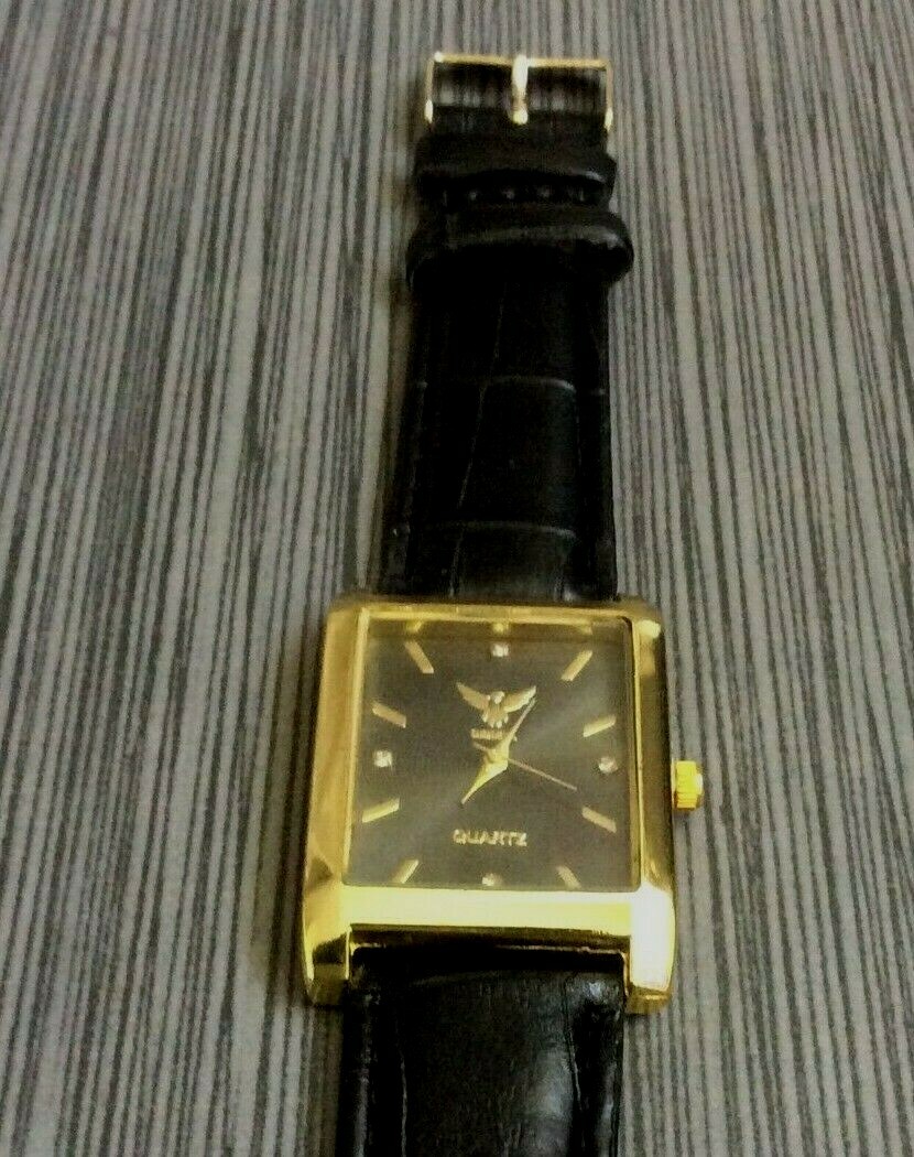 Geneva Men's Gold Watch Rectangle Black Dial on a Black Geneva Men's Gold Watch Rectangle Black Dial on a Black