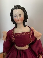 antique doll with porcelain head.