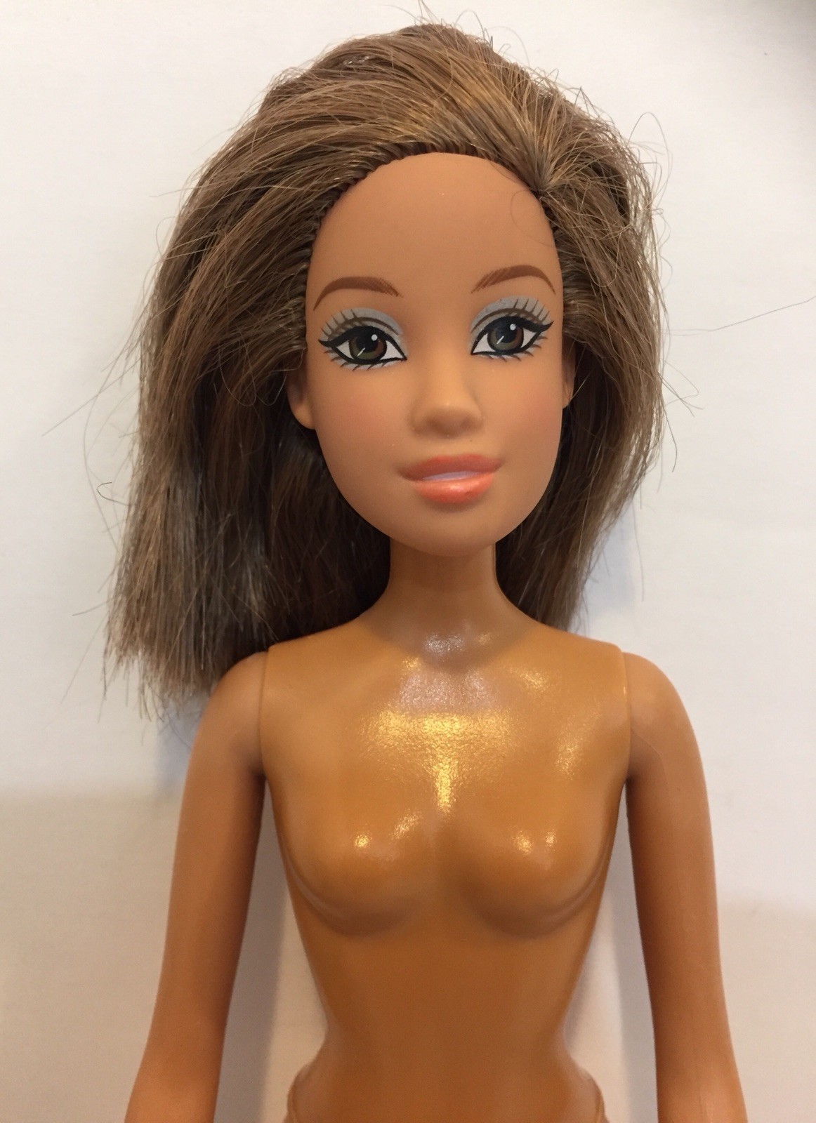barbie doll with brown hair and brown eyes