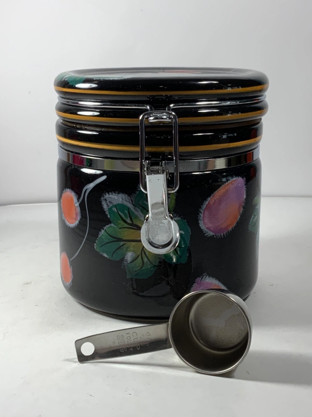 CIC Berry & Leaf Black Ceramic Canister with Metal Scoop 6 in.