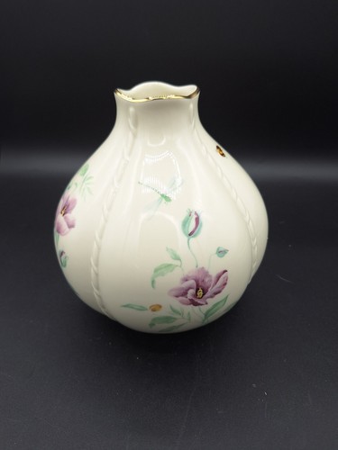 Cream round LENOX MORNINGSIDE vase with gold rim, purple floral accents, and green leaves on a dark background.