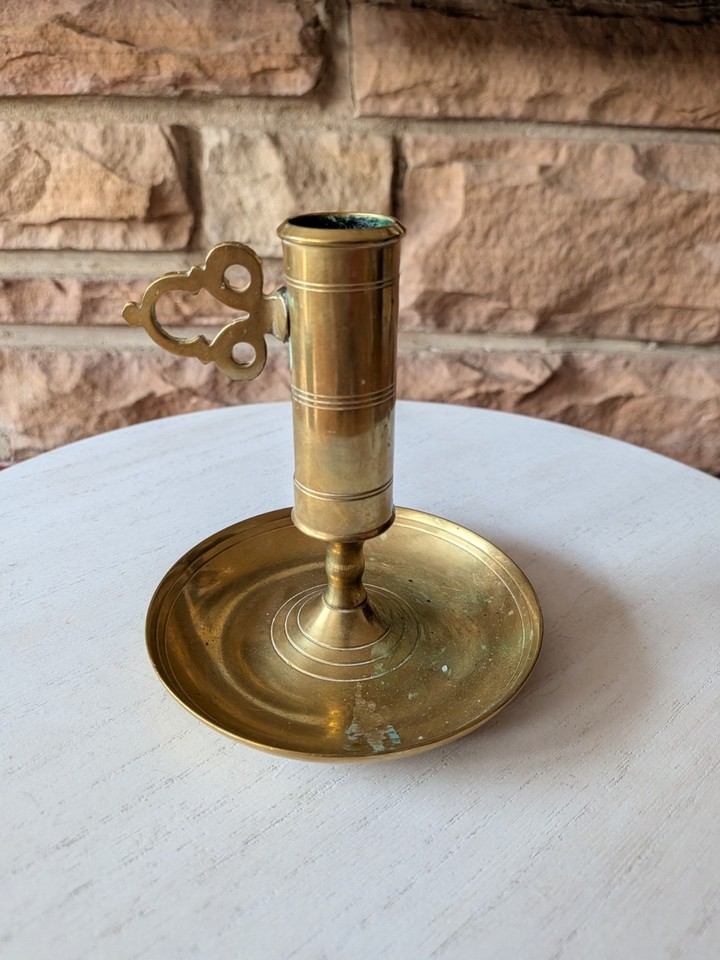 A genuine Swedish brass chamber candlestick with a push-up ejector mechanism — functional, beautifully aged, and the kind of antique detail that design nerds obsess over.