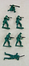 Six Green Plastic Toy Soldiers